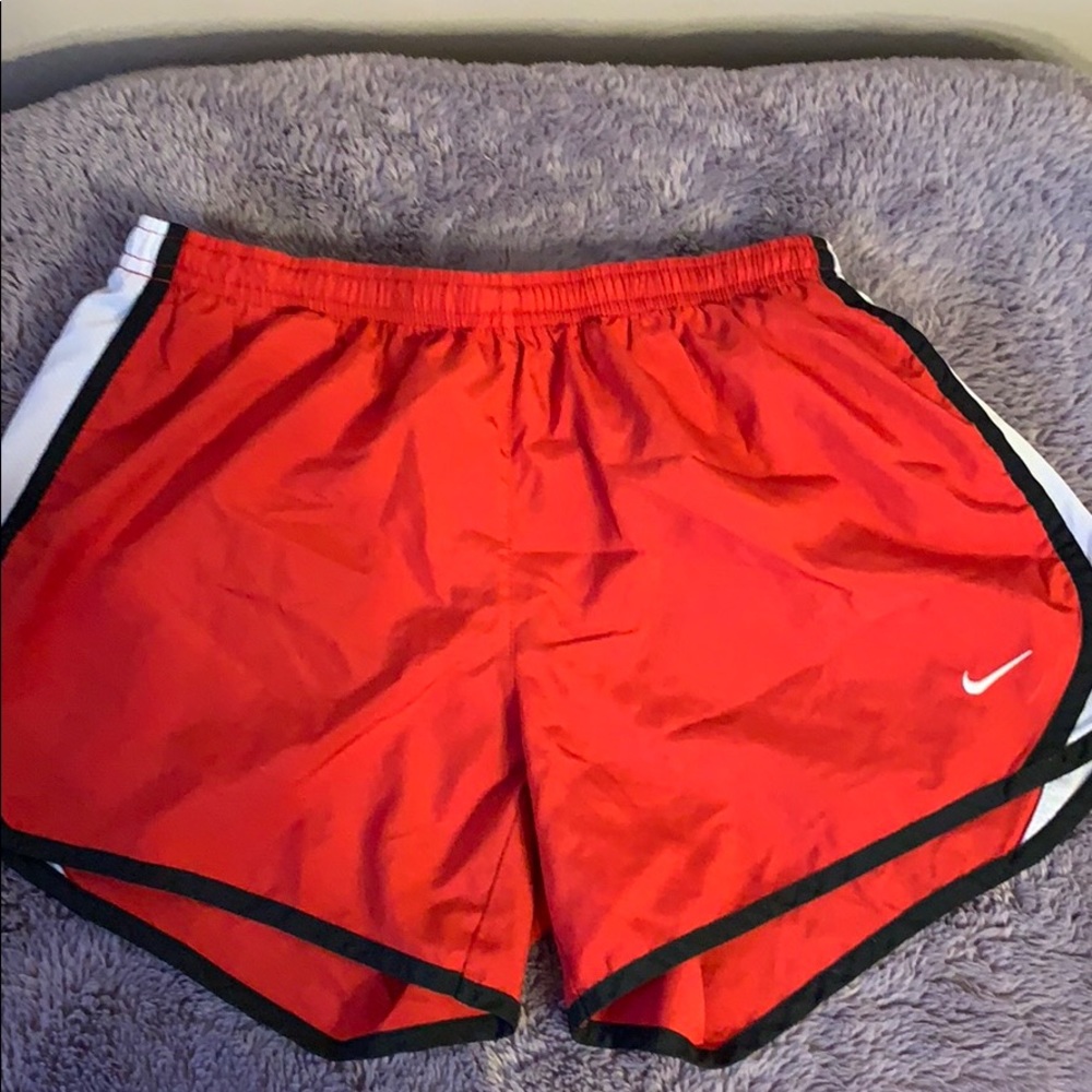 Red Nike shorts size kids XL fits women Small/M
